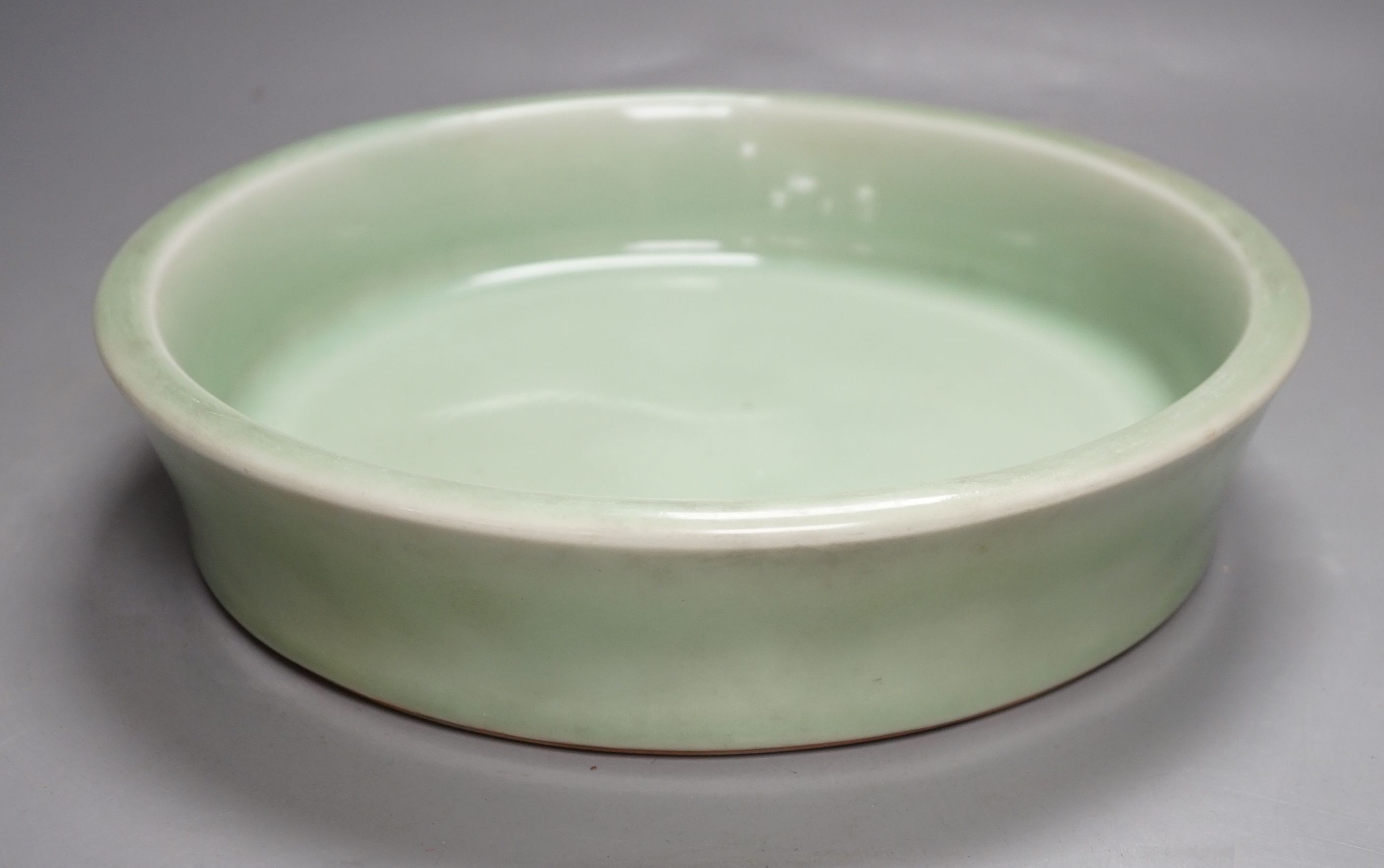 A Korean celadon glazed dish, 19th / 20th century-27 cms diameter.